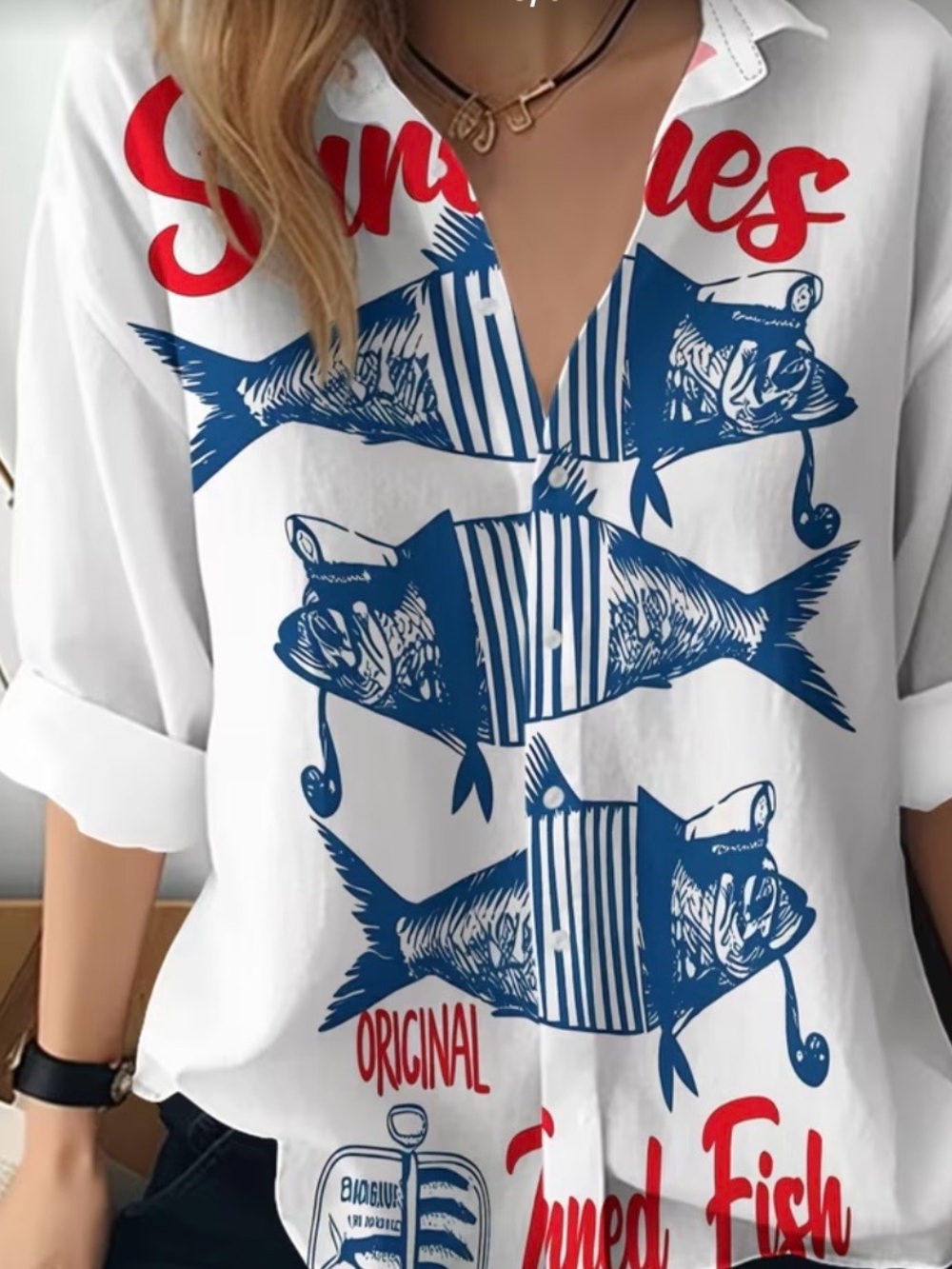 White Button-Up Blouse with Blue Fish Print and Red Script Accents
